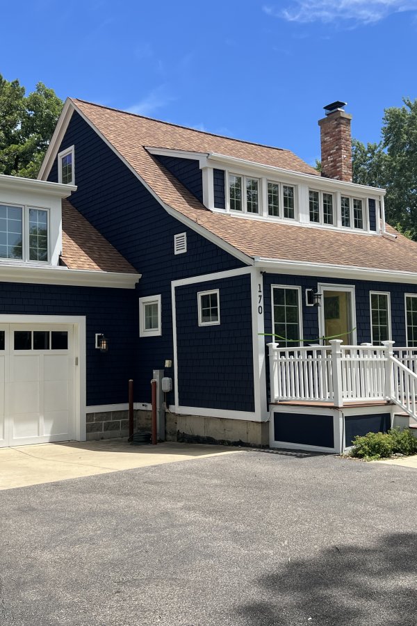 Full exterior repaint — cedar shake in deep navy with white trim